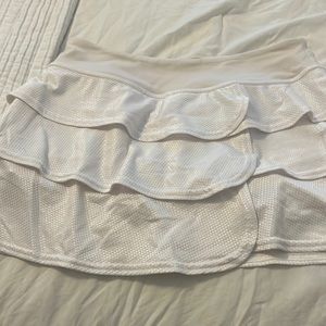 Adorable white ruffled tennis skirt.